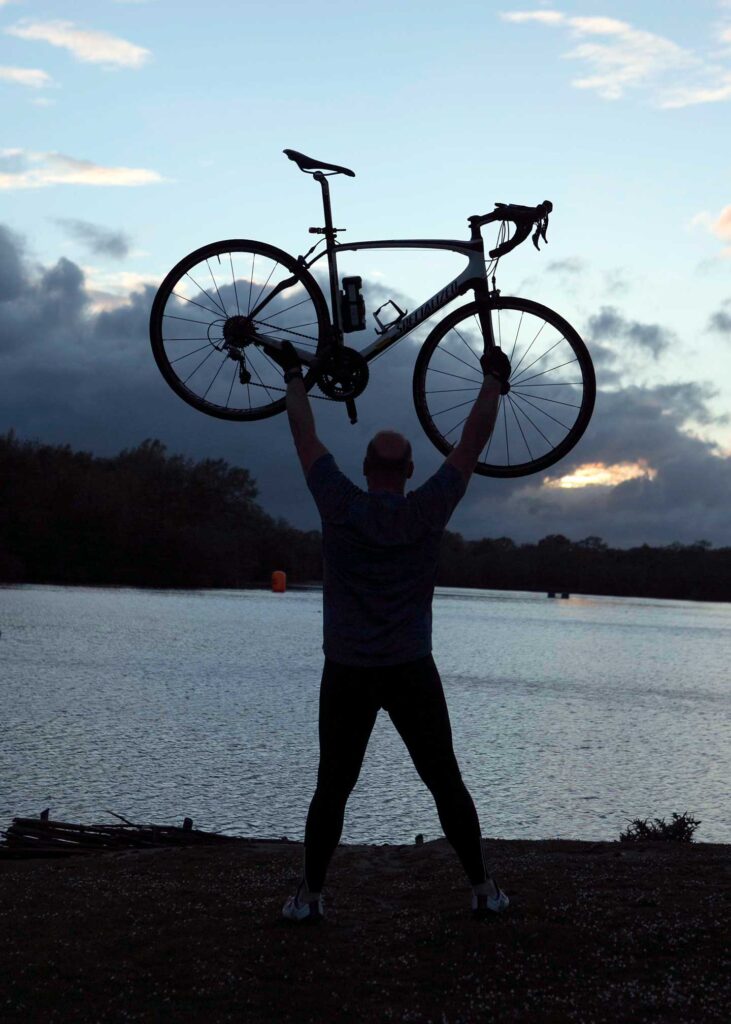 Andy Smith holding up a bike